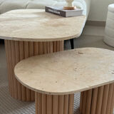 Oval coffee table duo travertine and raw fluted wooden legs.