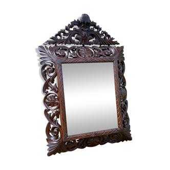 Beveled mirror in chiseled wood late nineteenth century.