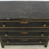 Chest of drawers in black lacquered wood