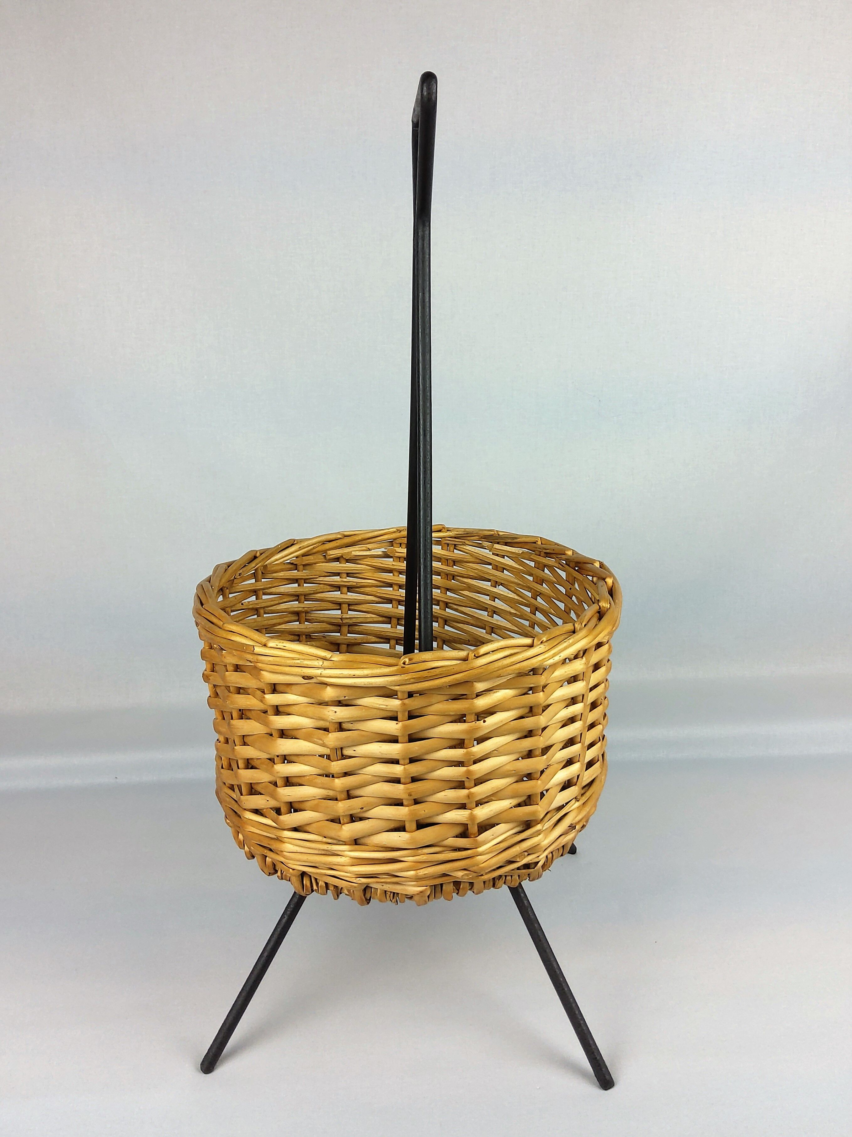 Black metal rattan trash can on 1960