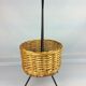 Black metal rattan trash can on 1960
