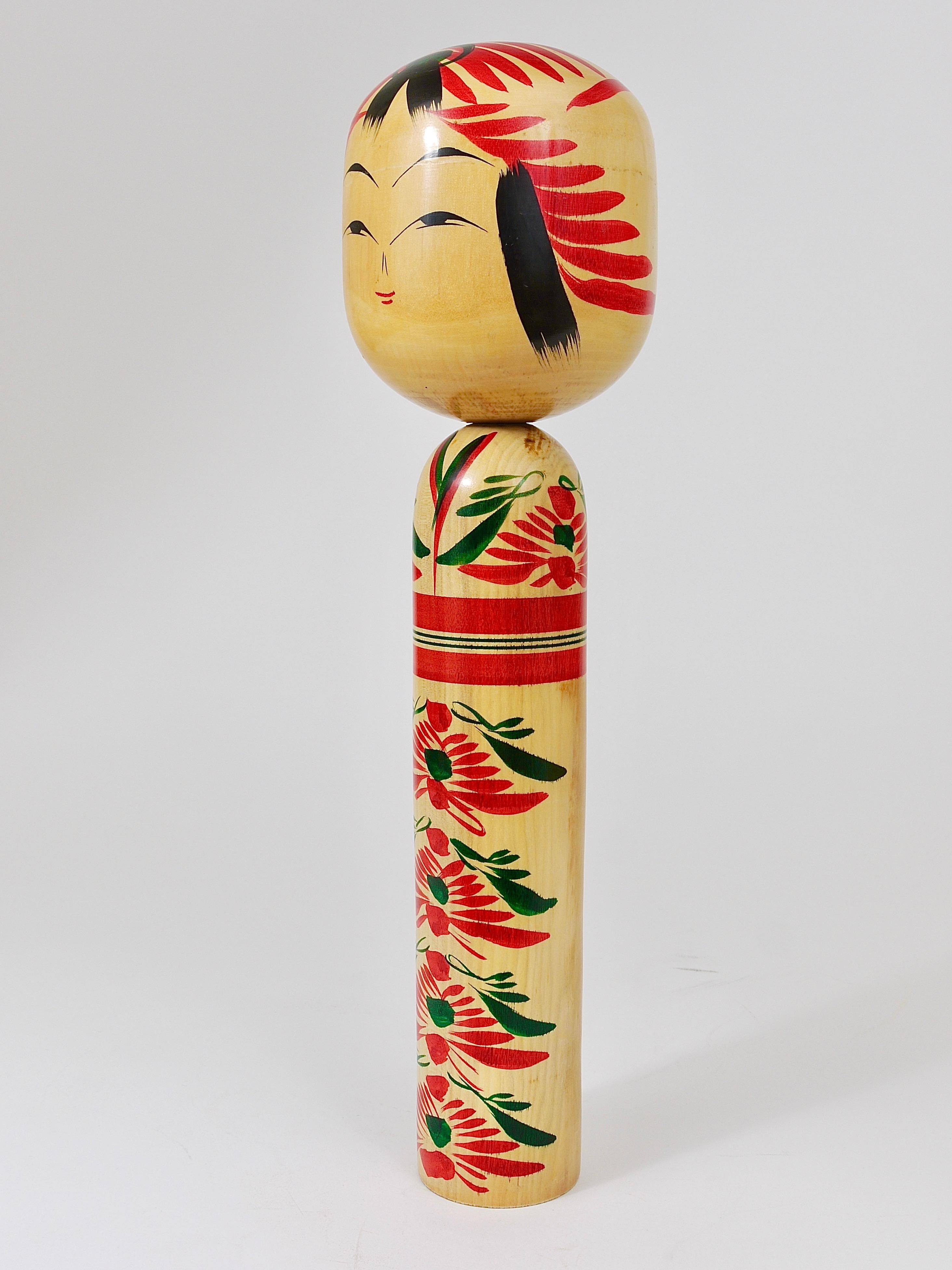 Decorative Kokeshi doll sculpture from northern Japan, hand-painted, signed.