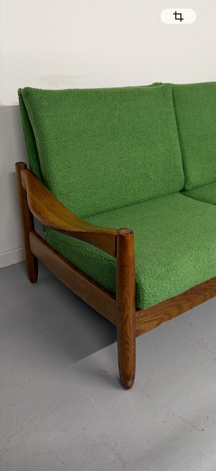 Living room sofa and Scandinavian design armchairs from the 1960s in green boucle.