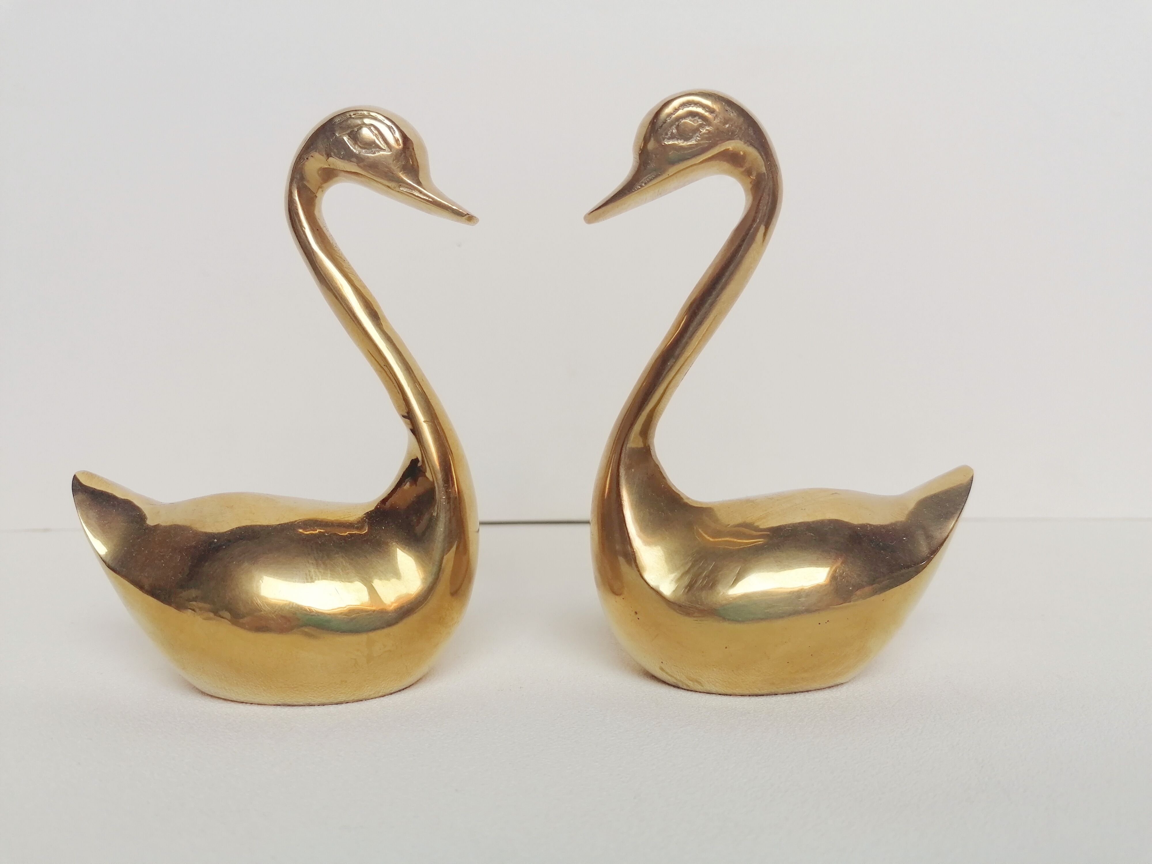 Two ducks made of solid brass