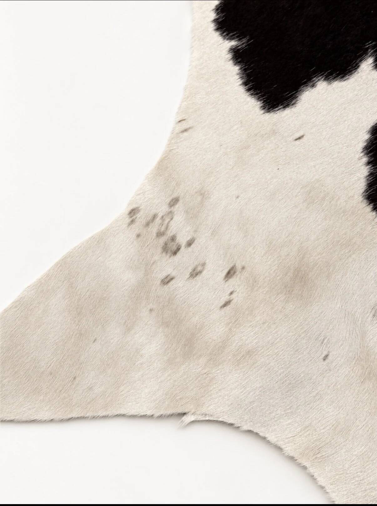 Tapis en peau de vache véritable noir et blanc