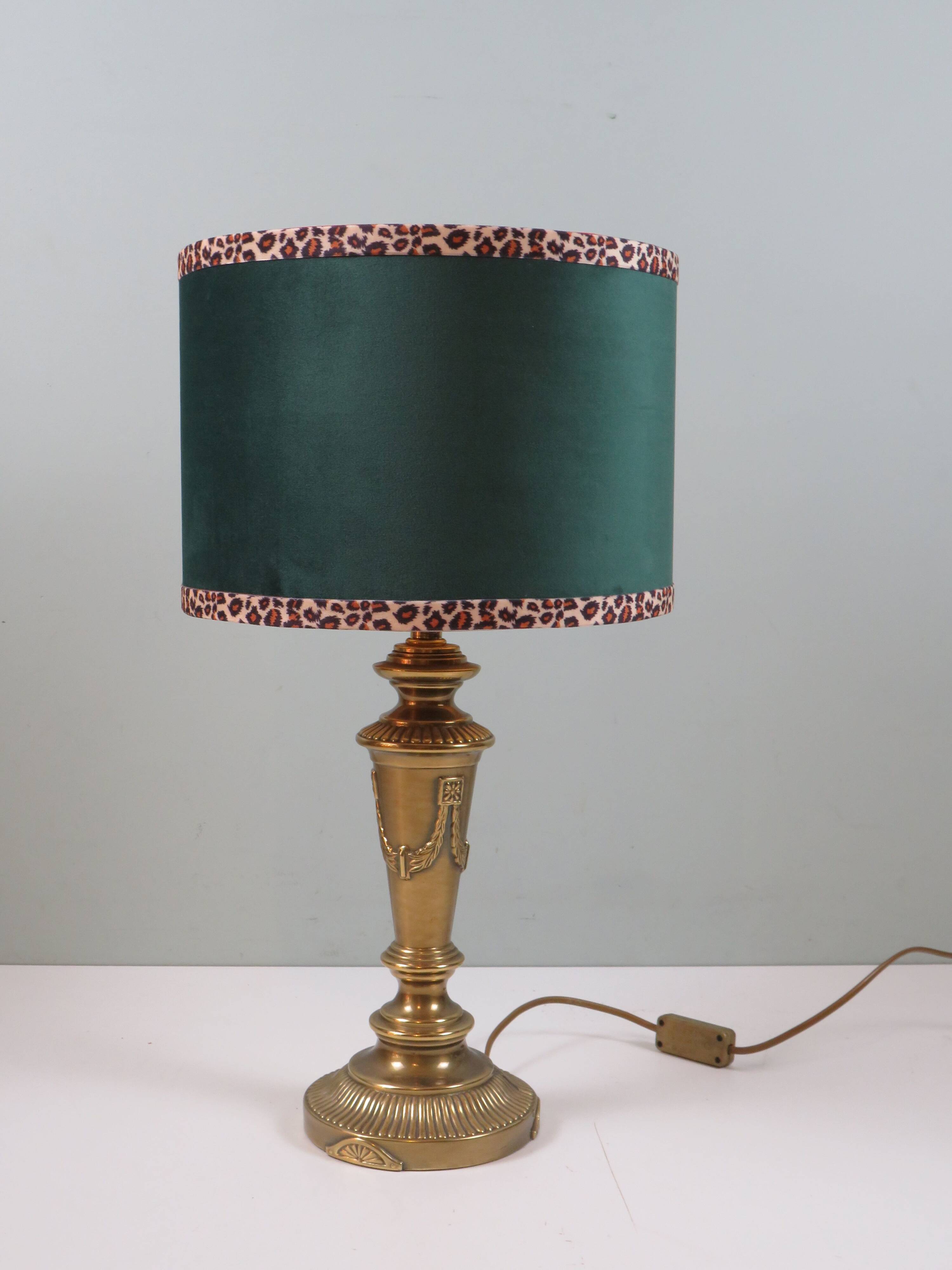 Vintage brass table lamp with green velvet shade.