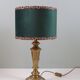 Vintage brass table lamp with green velvet shade.