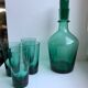 Set of a decanter and 4 design glasses in green glass 70s