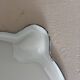 Vintage enamelled white metal milk jug with fruits.