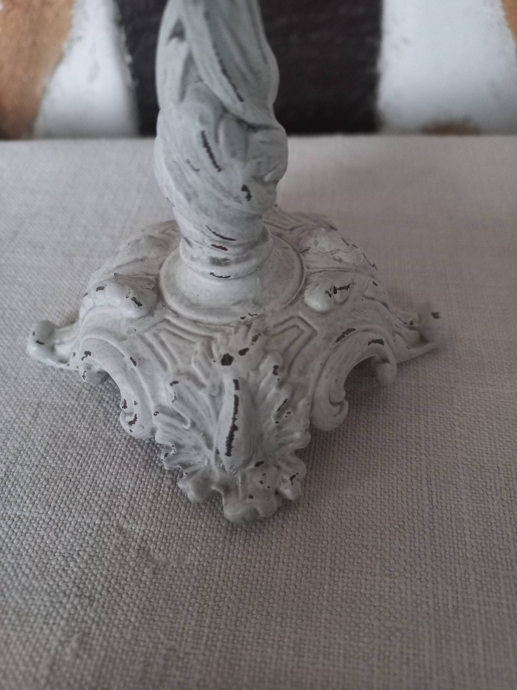 Old grayed white patinated candle holder