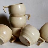 Six vintage potter's ceramic cups with vanilla enamel