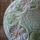 Antique cup and saucer in majolica.