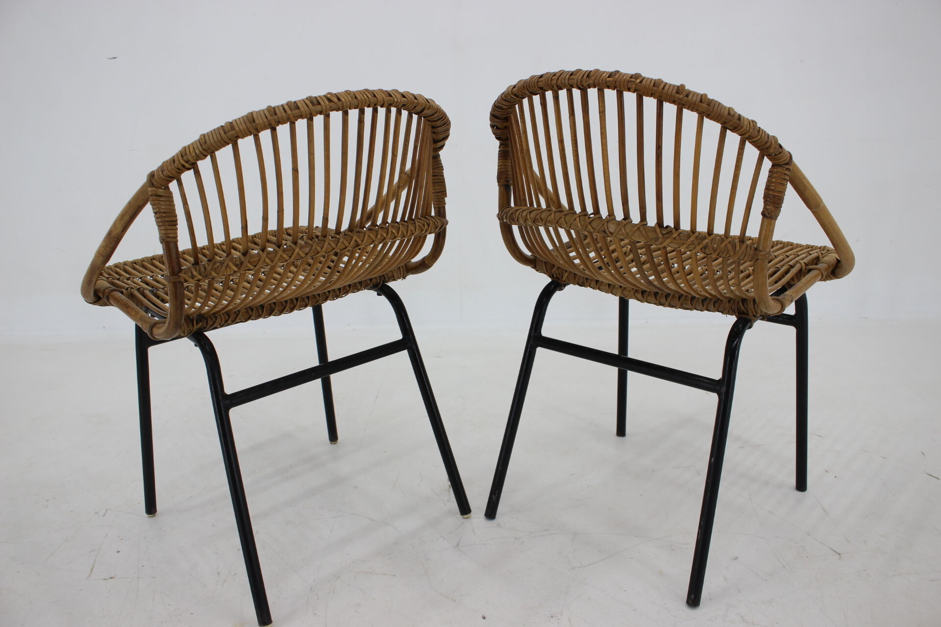 1970s pair of Alan Fuchs rattan and iron lounge chairs, Czechoslovakia