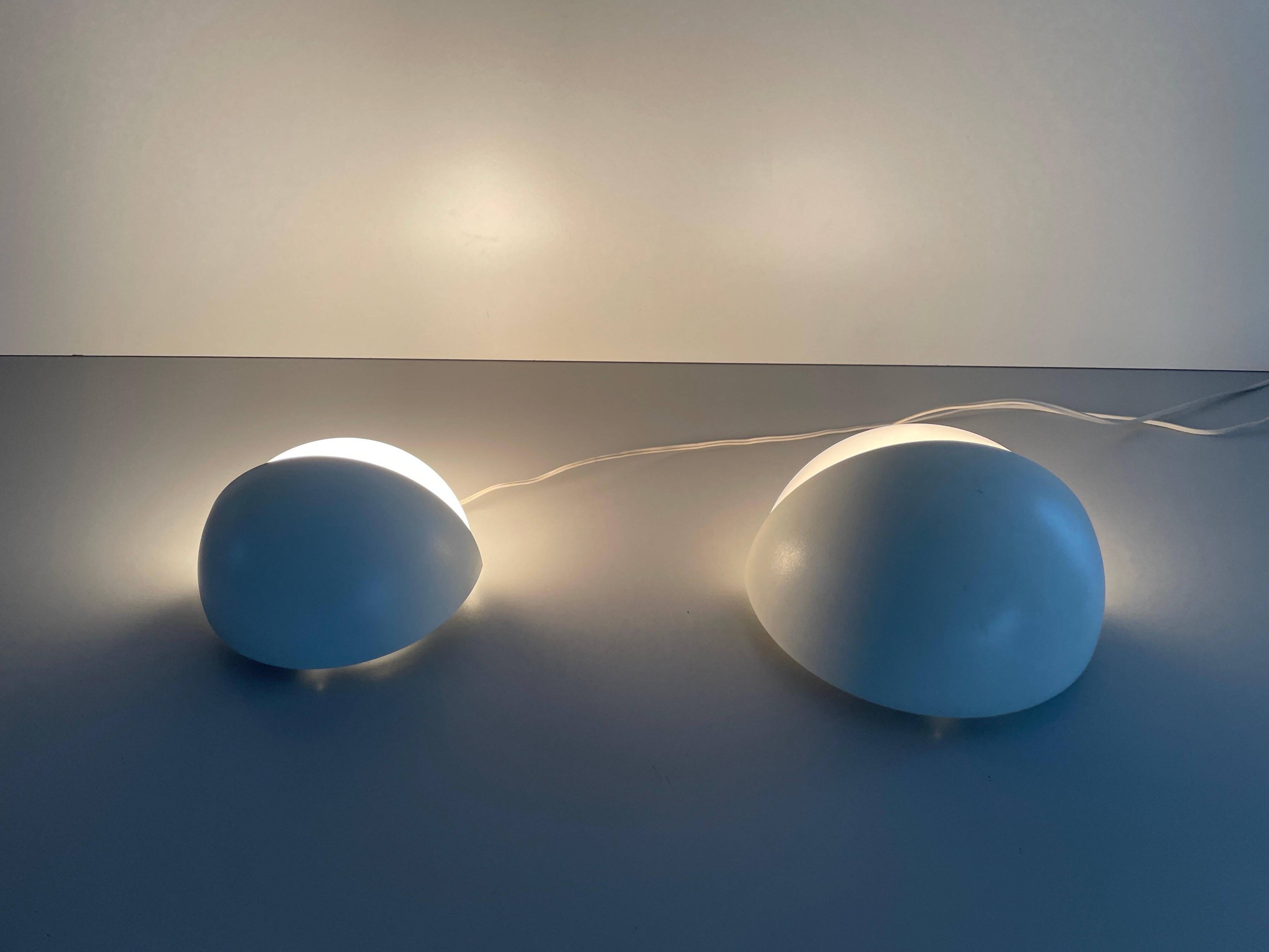 Round wall lights, small and large, in white metal by Bega, 1970s, Germany.