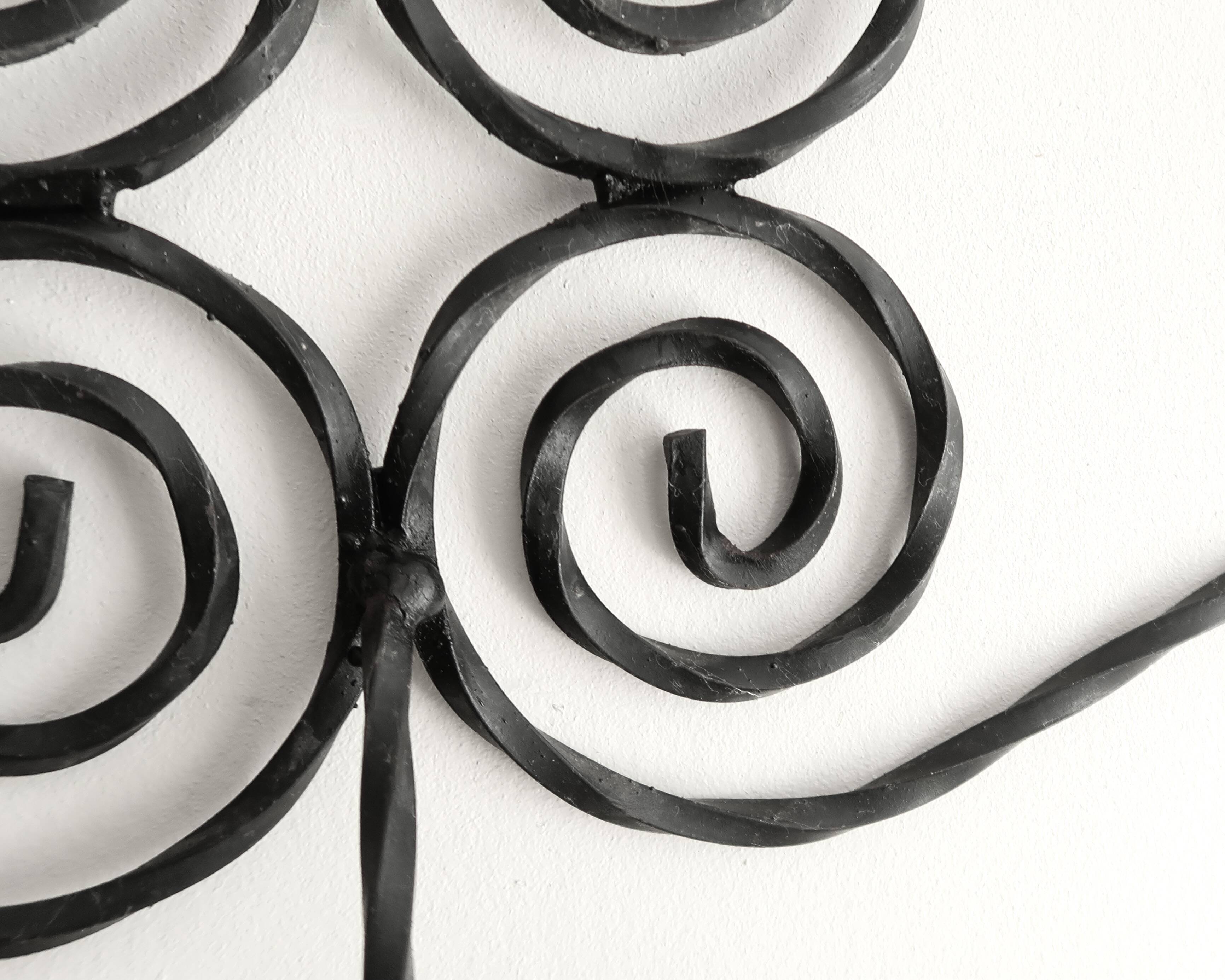 Twisted wrought iron wall coat rack with three hooks