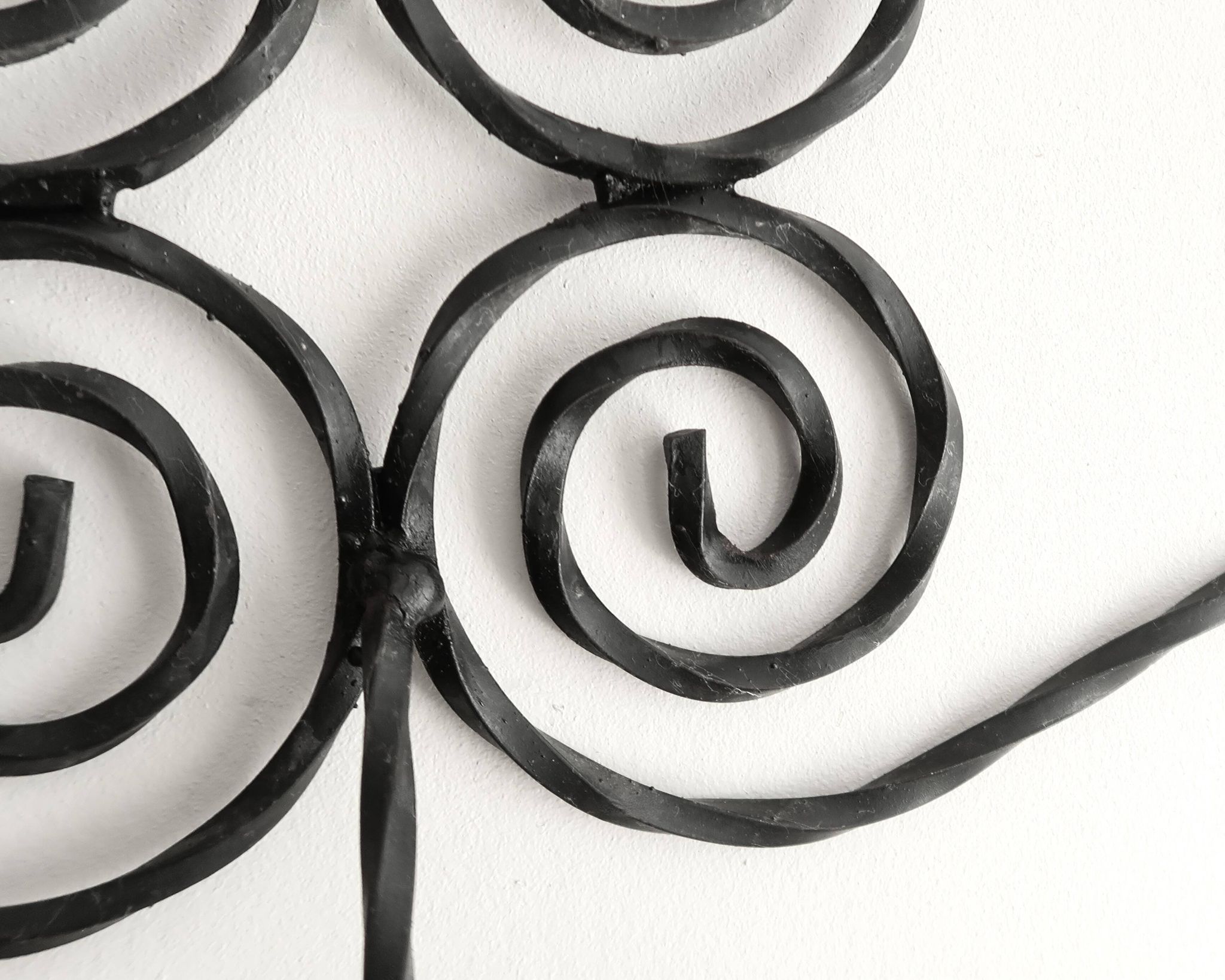 Twisted wrought iron wall coat rack with three hooks