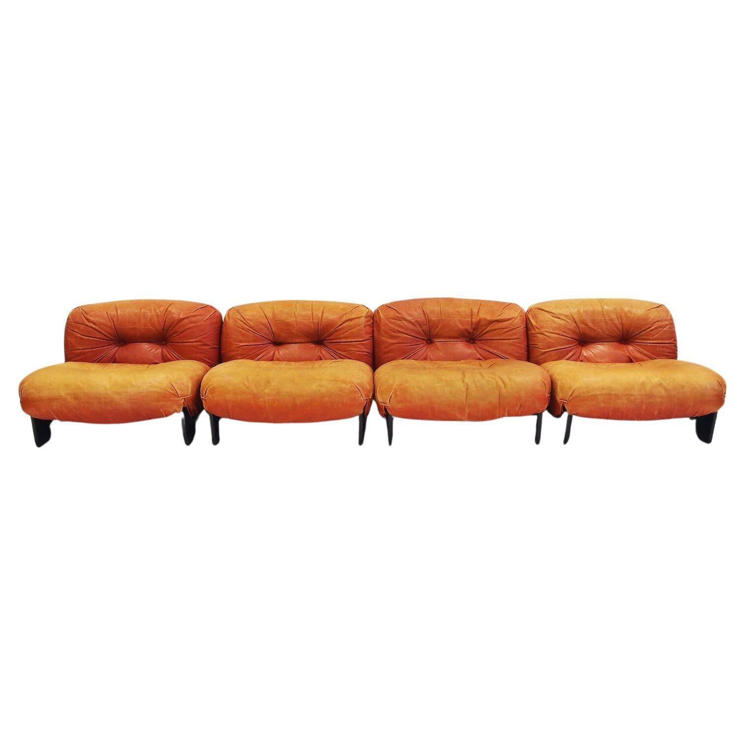 Set of four modular sun loungers by Giuseppe Munari upholstered in cognac leather.