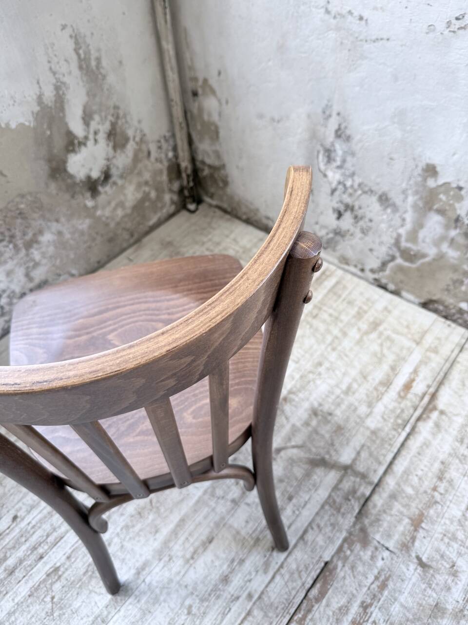 Set of 14 walnut bistro chairs.