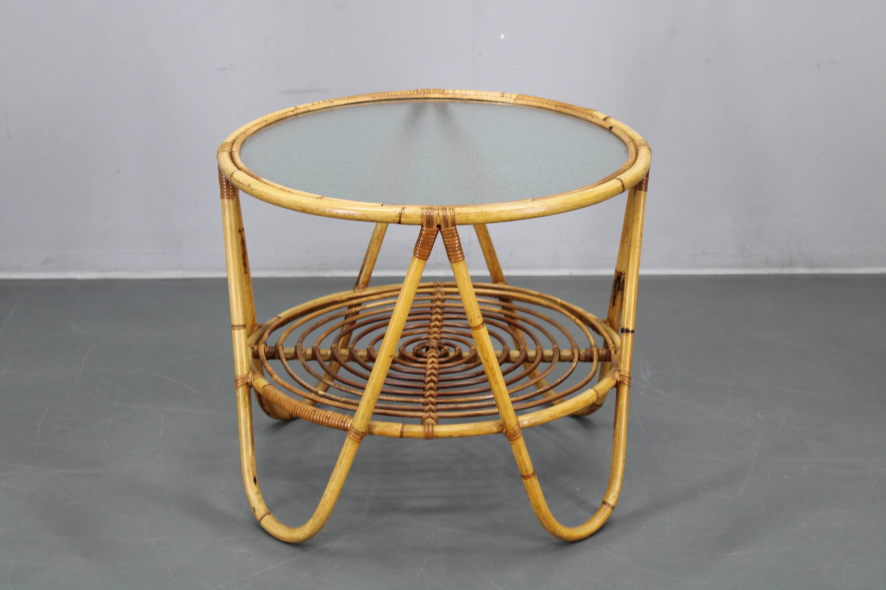 1960s Italian rattan coffee table with glass top, mid-century round design