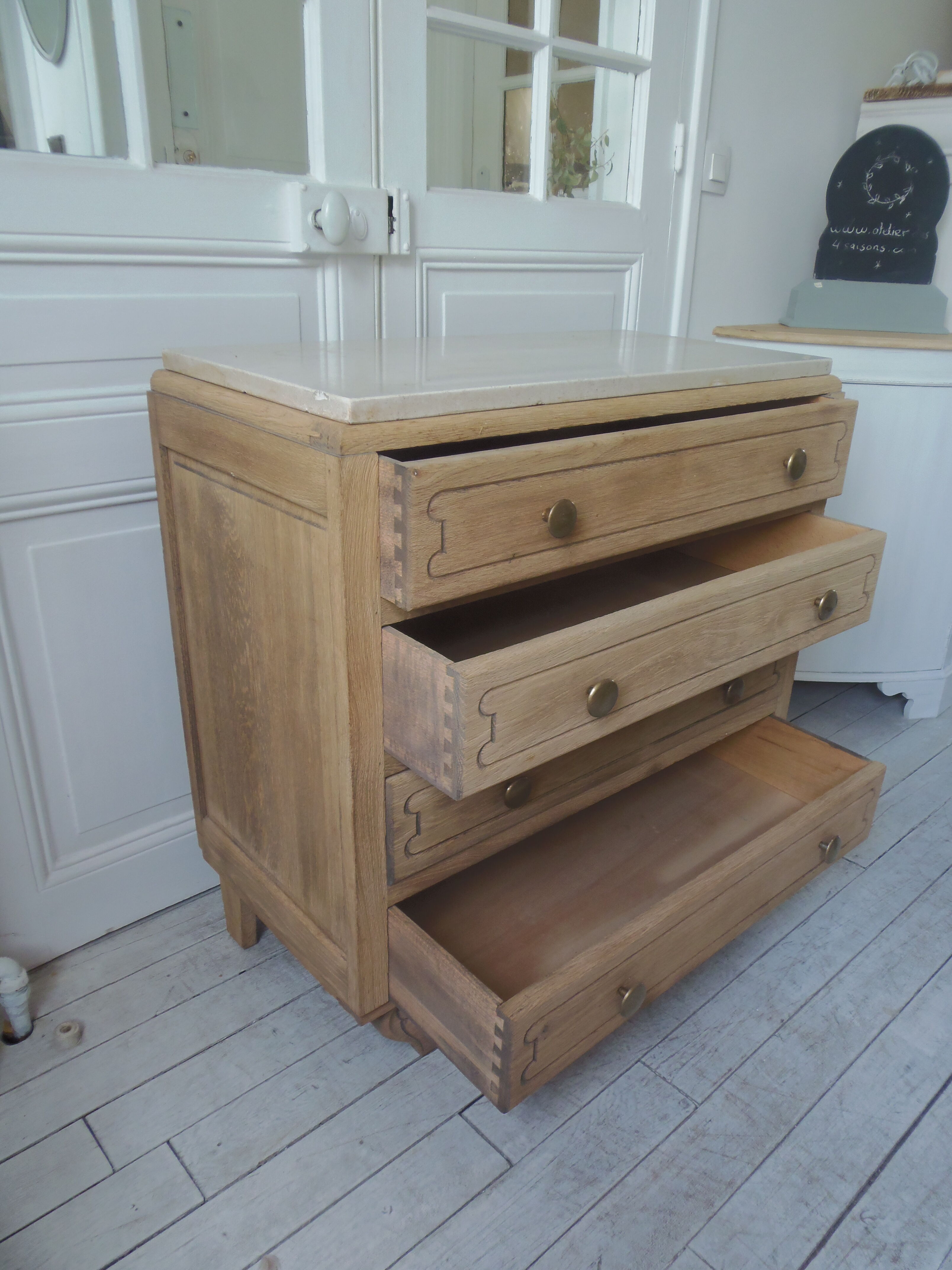 Vintage oak chest of drawers, a travertine plate laid for tray.