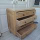 Vintage oak chest of drawers, a travertine plate laid for tray.