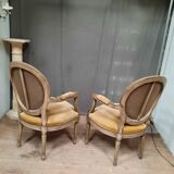 Pair of Louis XVI style medallion armchairs