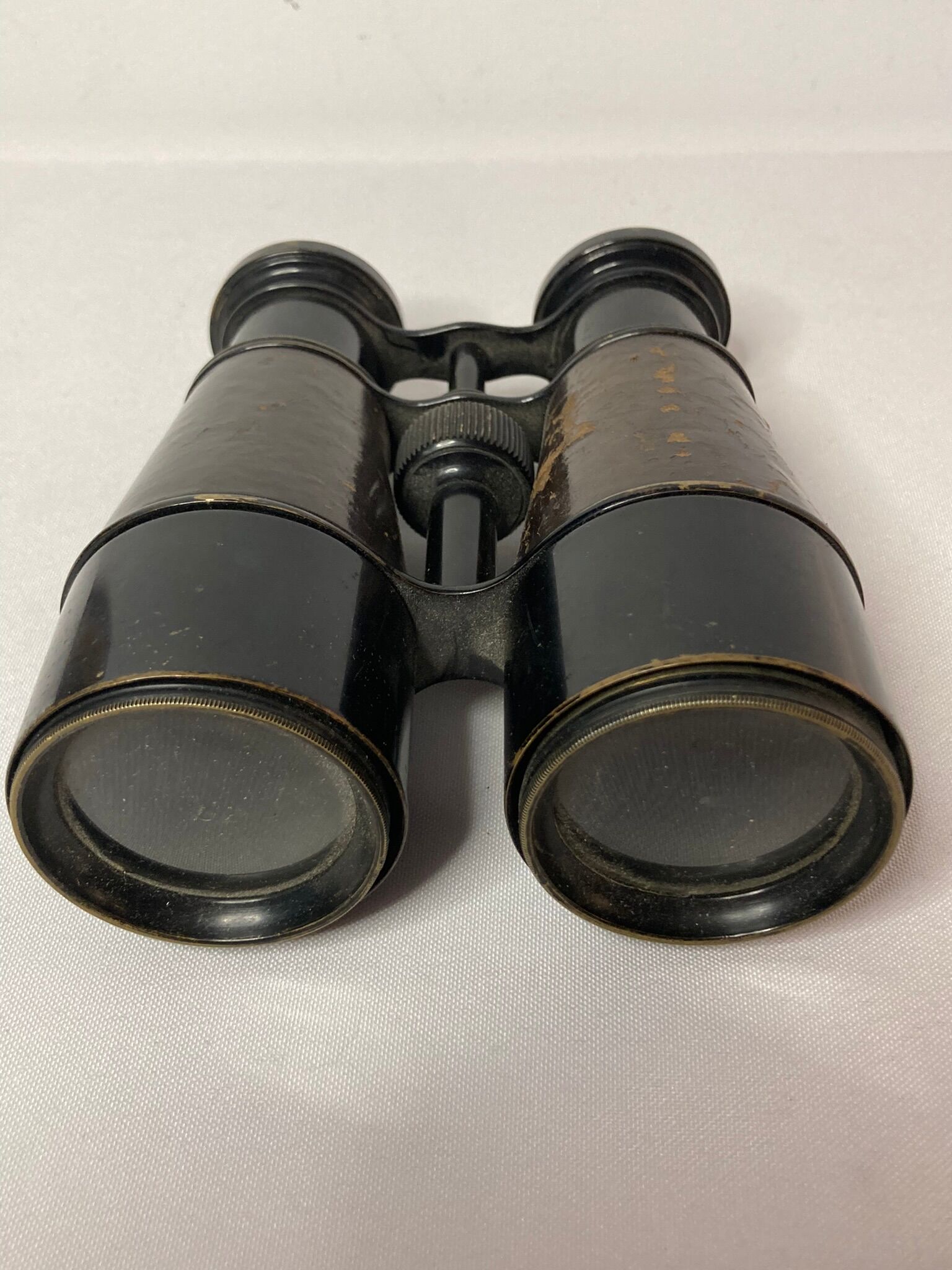 Old pair of XXth leather-wrapped binoculars