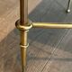 Neoclassical brass coffee table with a black leather top and golden borders from Maison Jansen.