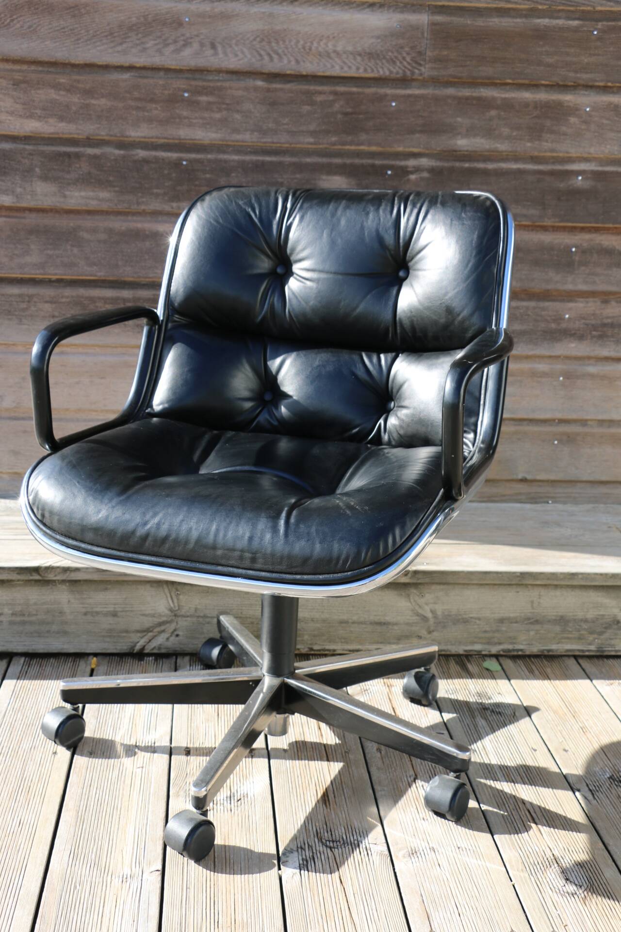 POLLOCK black leather reclining armchair with casters