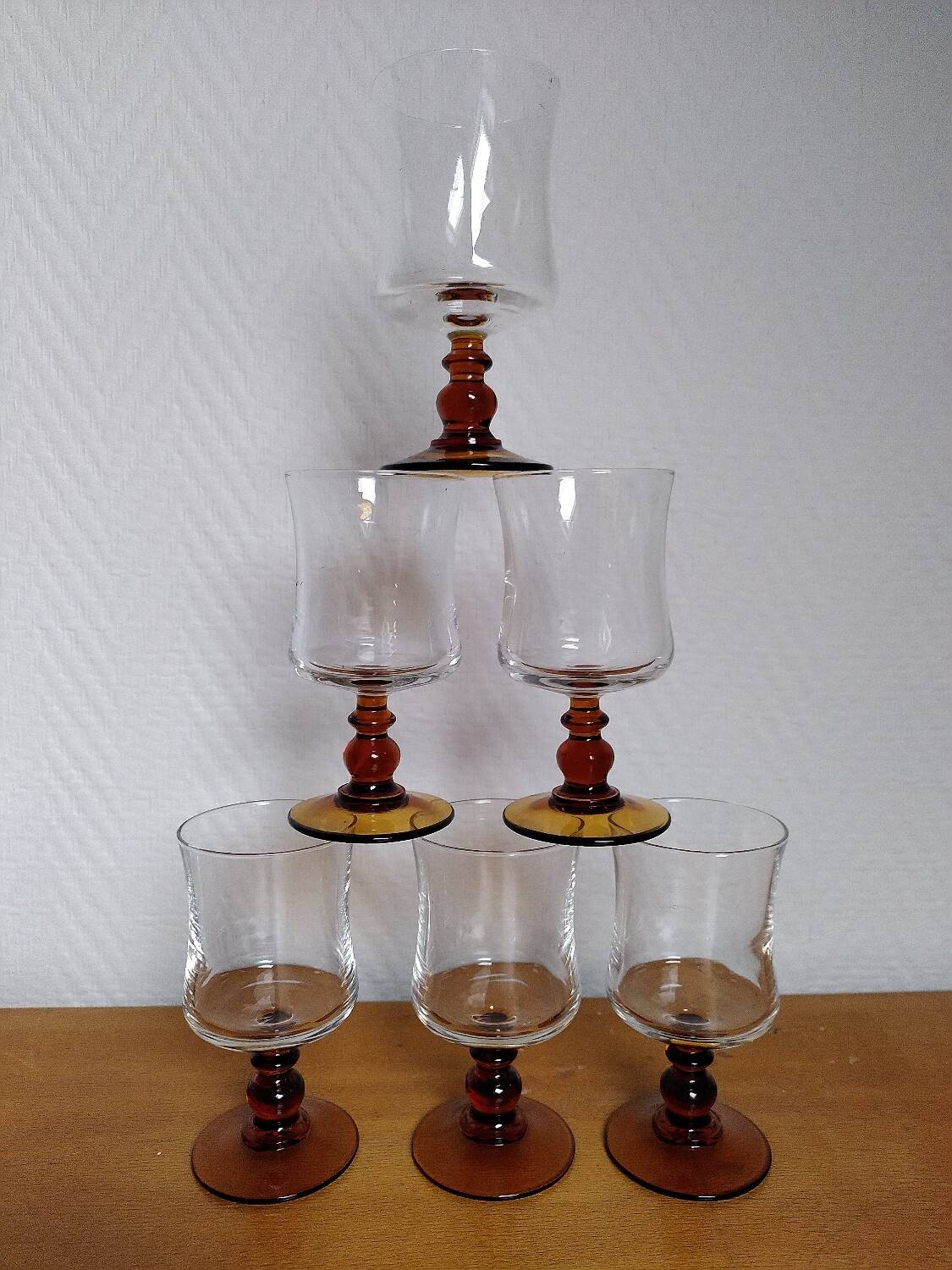 6 amber stemmed glasses