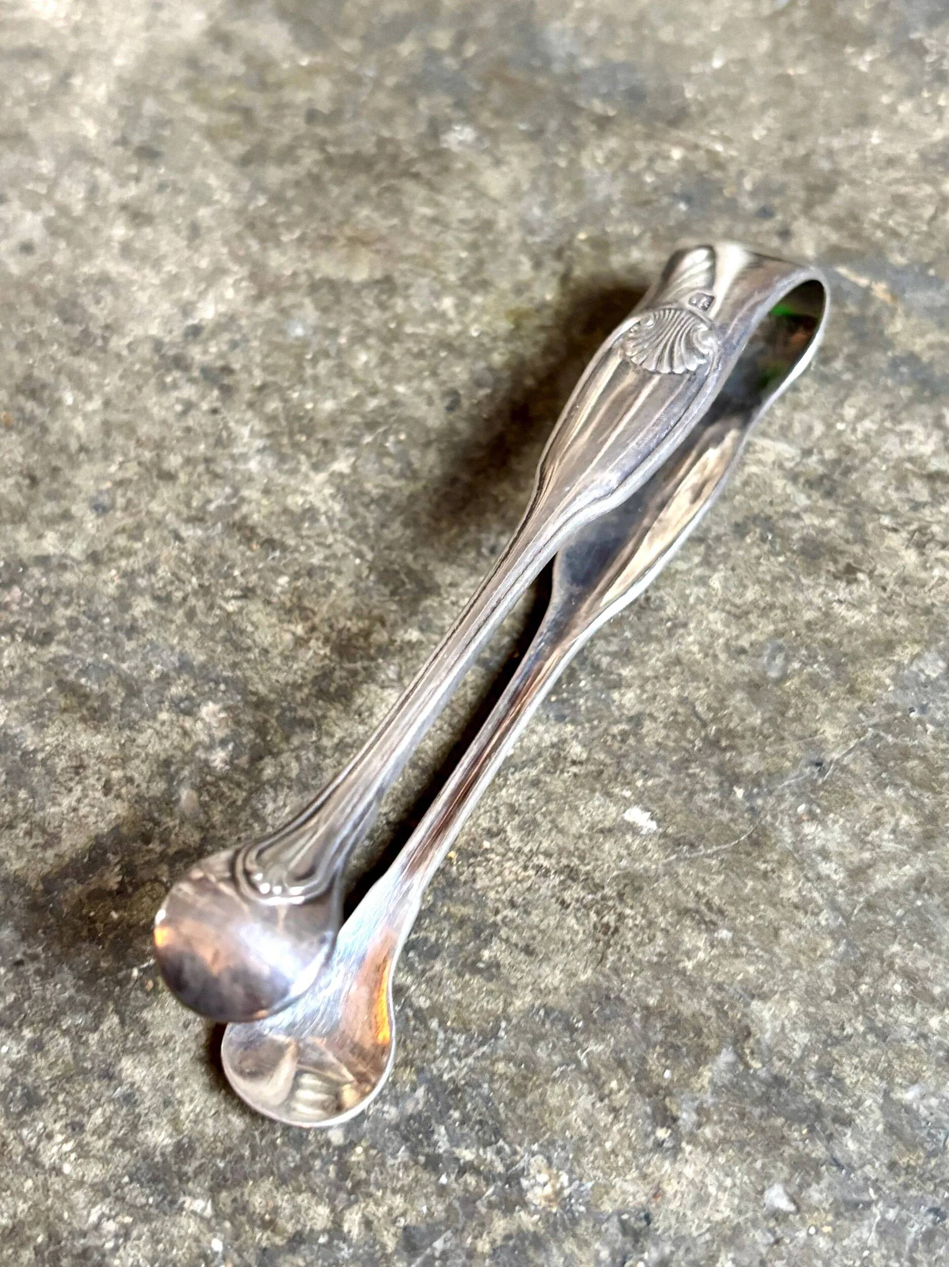 Christofle silver-plated sugar tongs with shell decoration