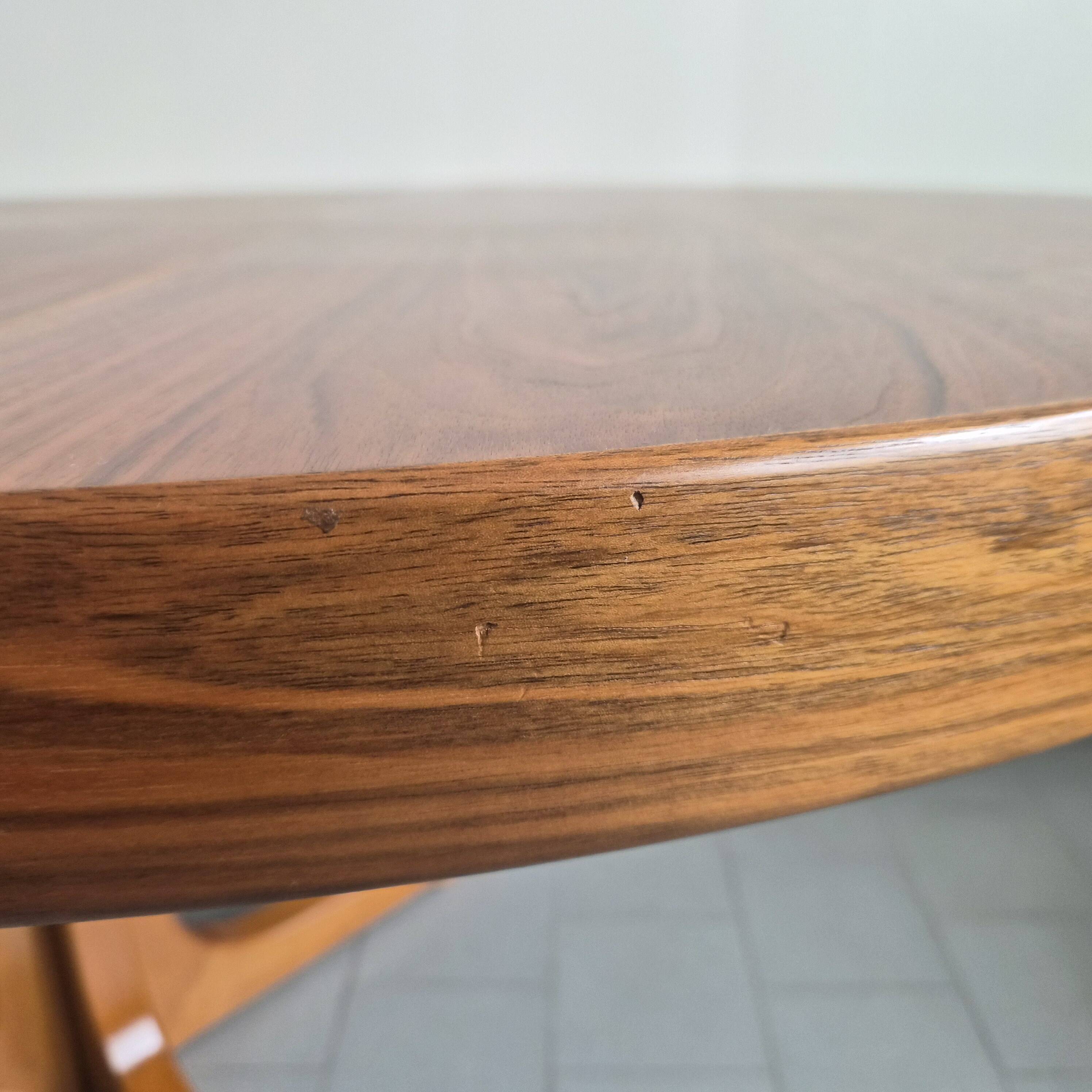 Baumann dining table 1960 extendable from 114 to 167 cm with integrated extensions.