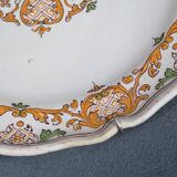 Two 18th century earthenware plates with grand feu decoration in ochre, green and manganese
