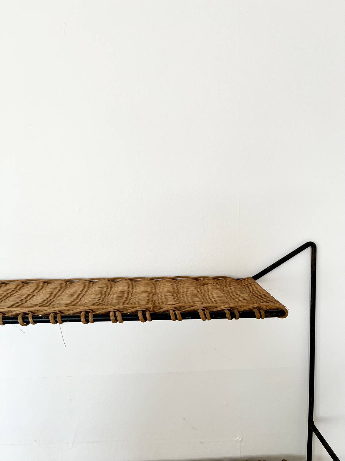 Raoul Guys rattan wall shelf 1950