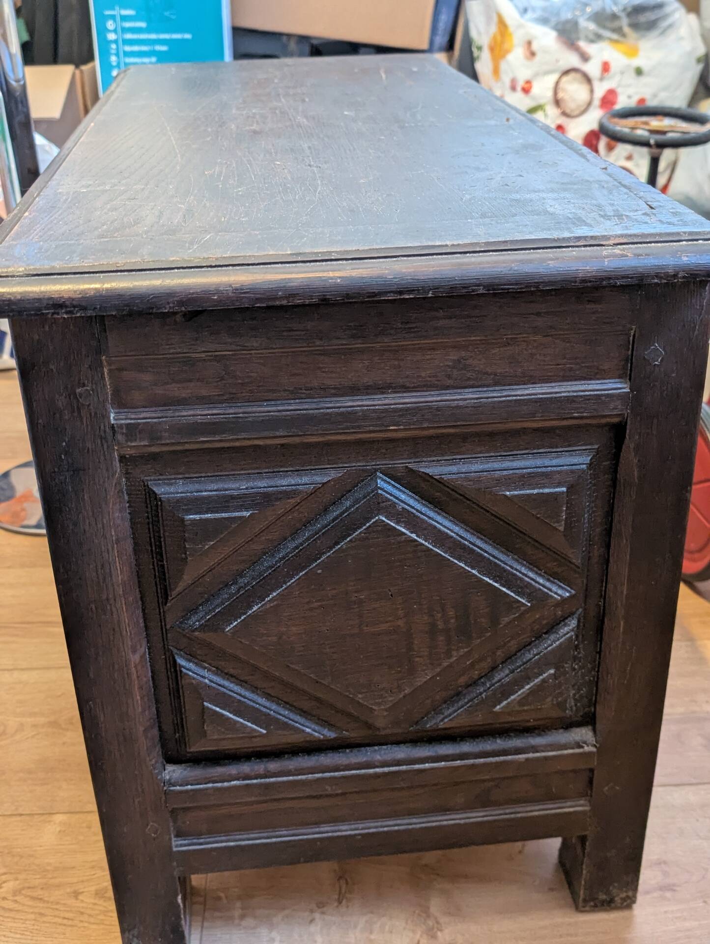 Antique dark wood chest with geometric paneling / pointed detail
