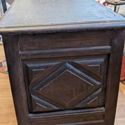 Antique dark wood chest with geometric paneling / pointed