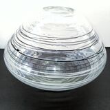 Textured oval blown glass vase with black and white glass spaghetti.