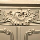 Low rocaille style sideboard in cream lacquered wood, circa 1900
