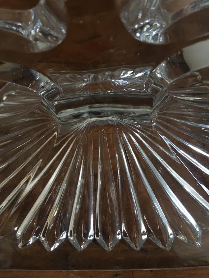 Three-pointed glass candlestick