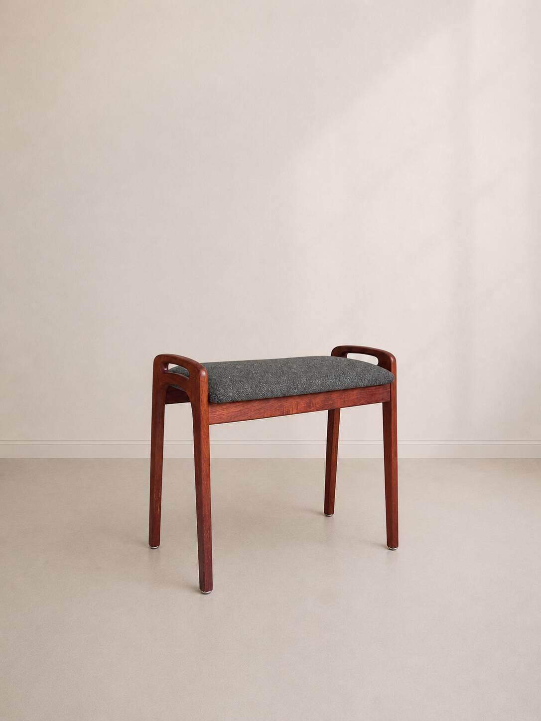 Teak piano bench attributed to Johannes Andersen for Uldum Møbelfabrik.