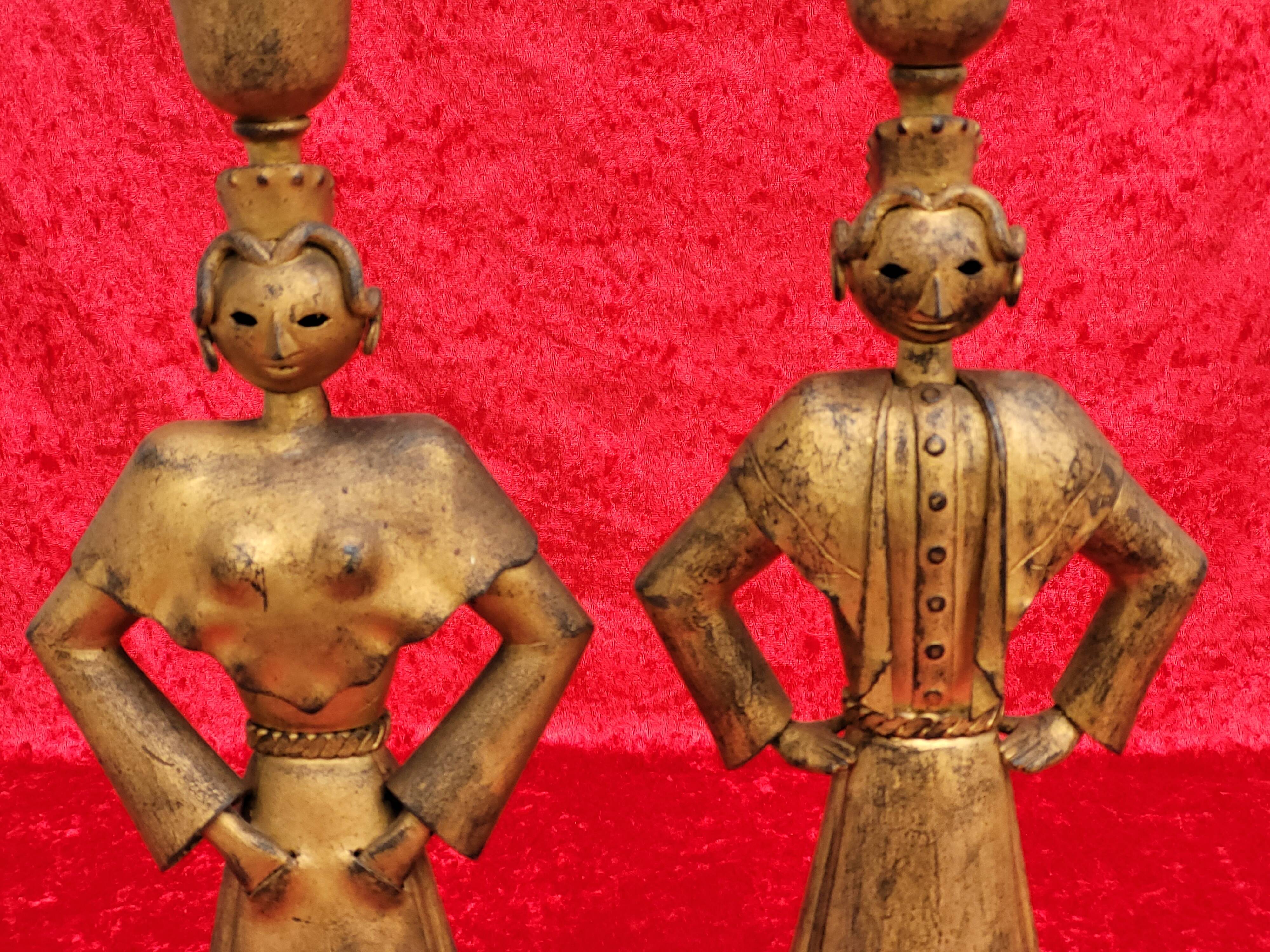 Pair of gilded beaten iron sculpture lamps attributed to Gilbert Poillerat