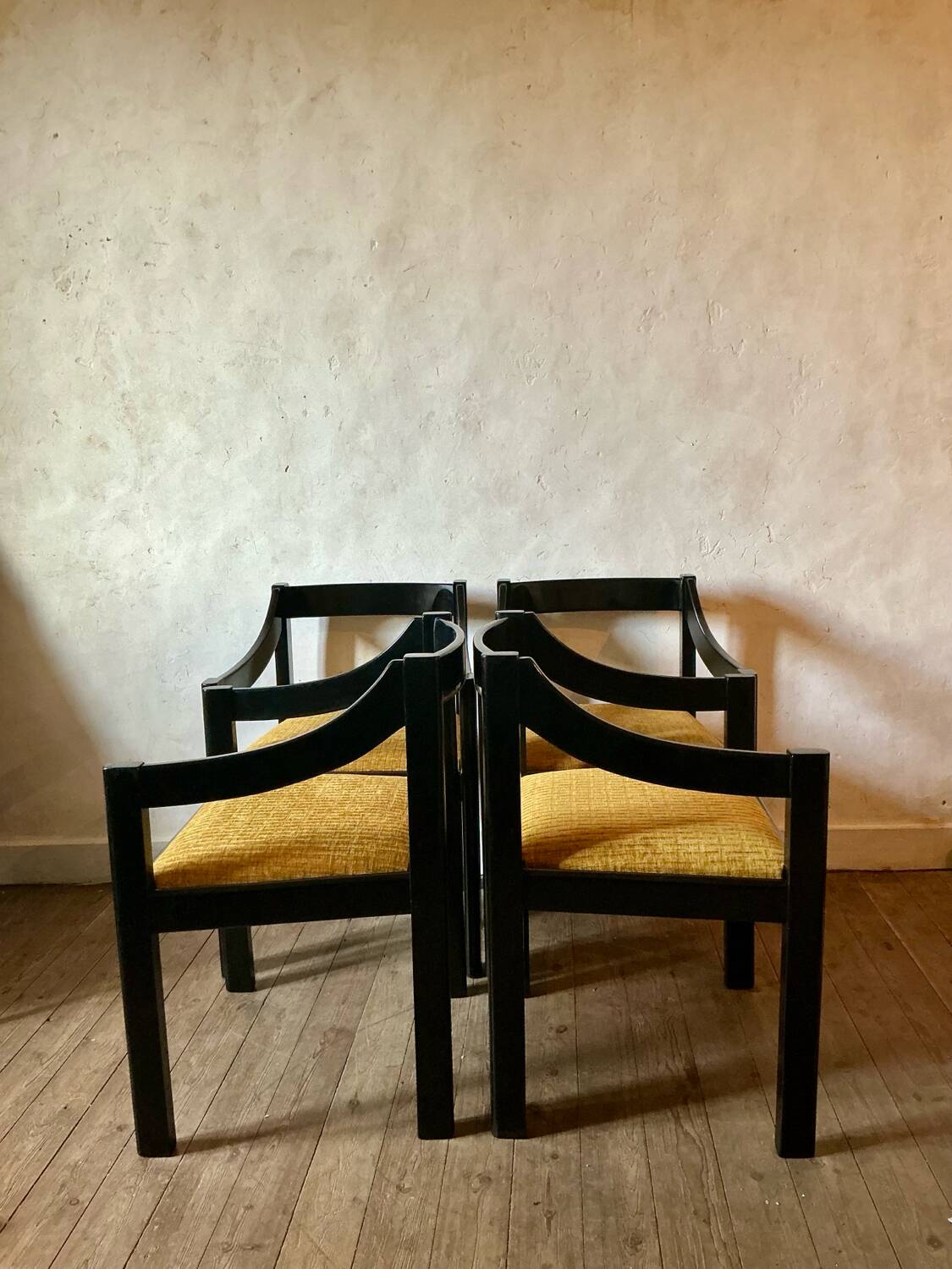 Four designer armchairs