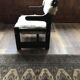 Set of 2 vintage wooden chairs with beige sheepskin seats, rustic style.
