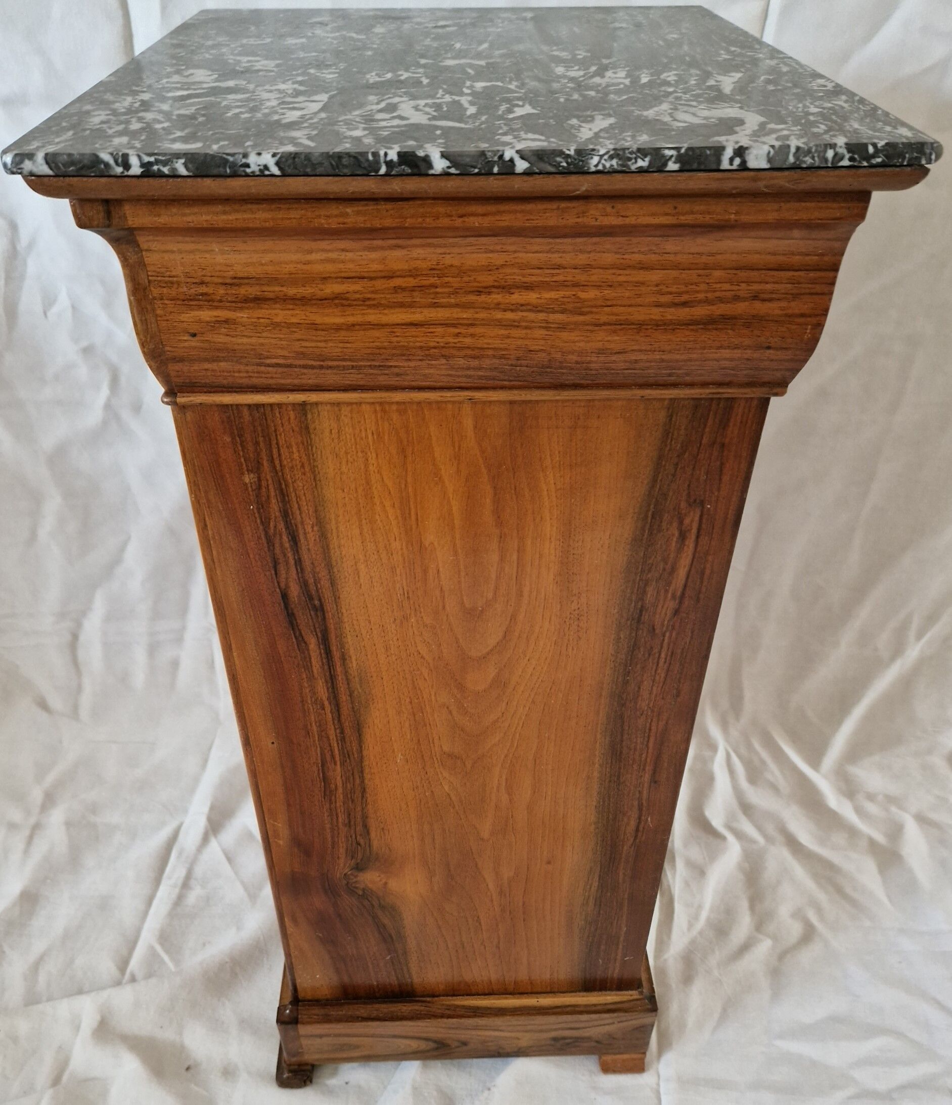 Elegant antique Napoleon III side table in walnut with black marble veneer.