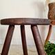 Old wooden tripod wooden farm stool made of wood