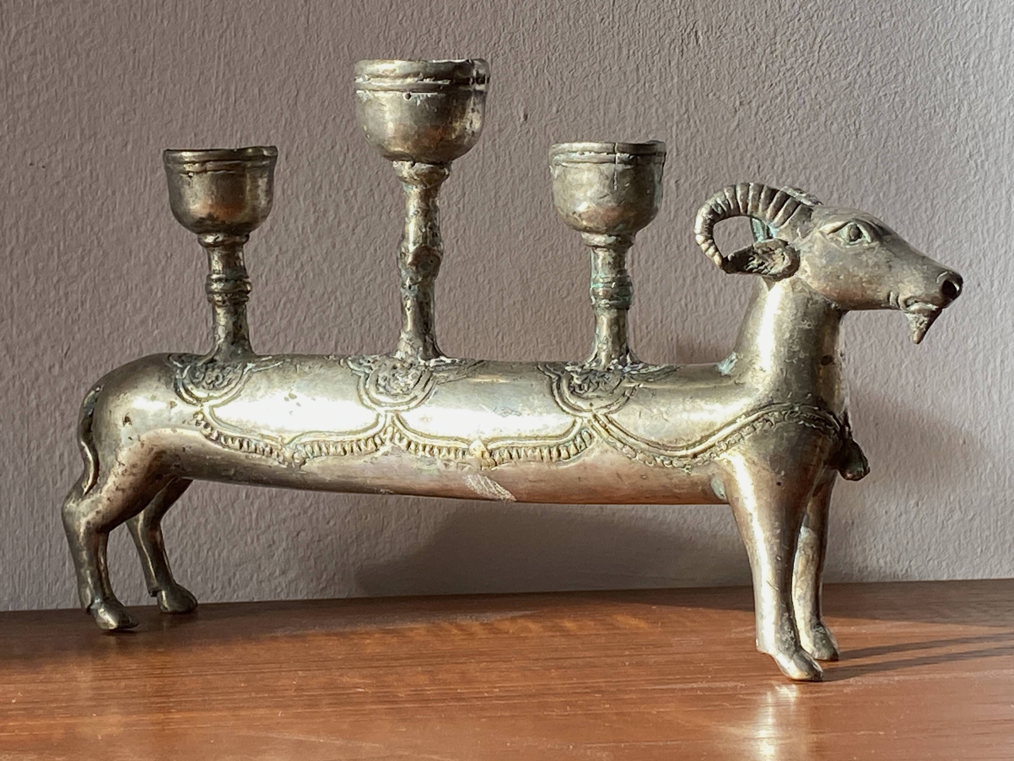 Pair of religious silver-plated zoomorphic candlesticks