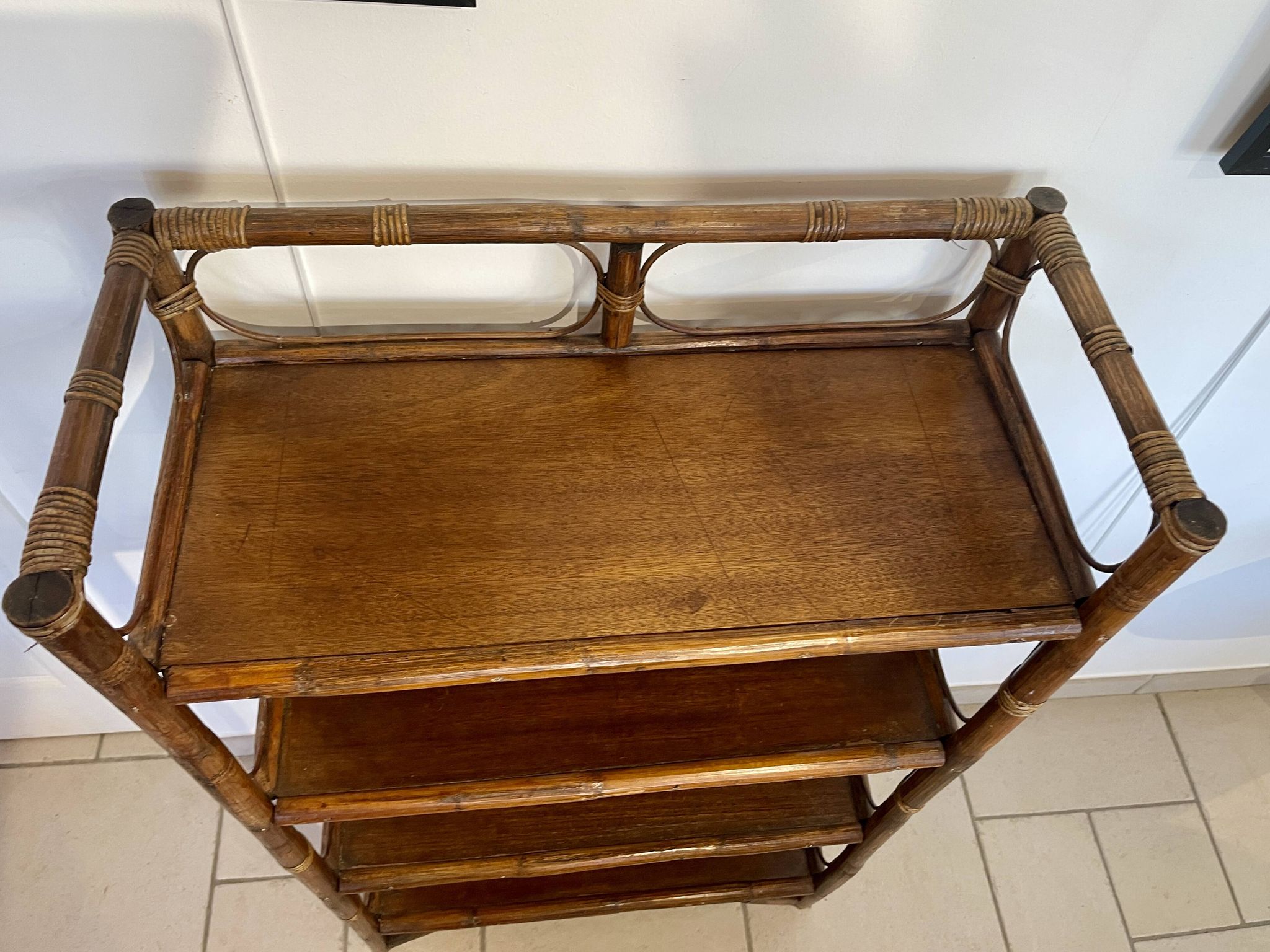 Shelf on rattan and bamboo legs from the 70s