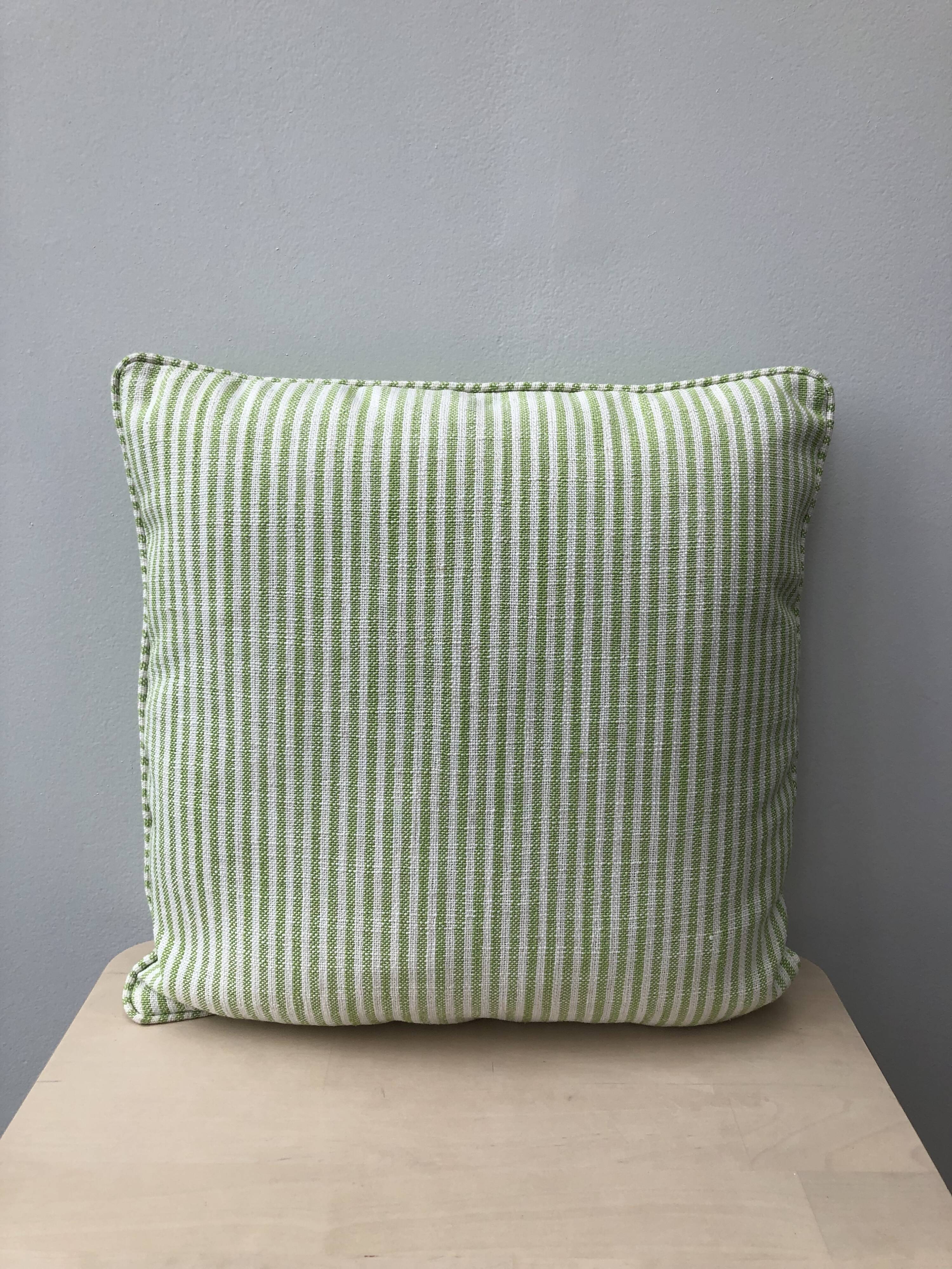 Green and white striped cushion