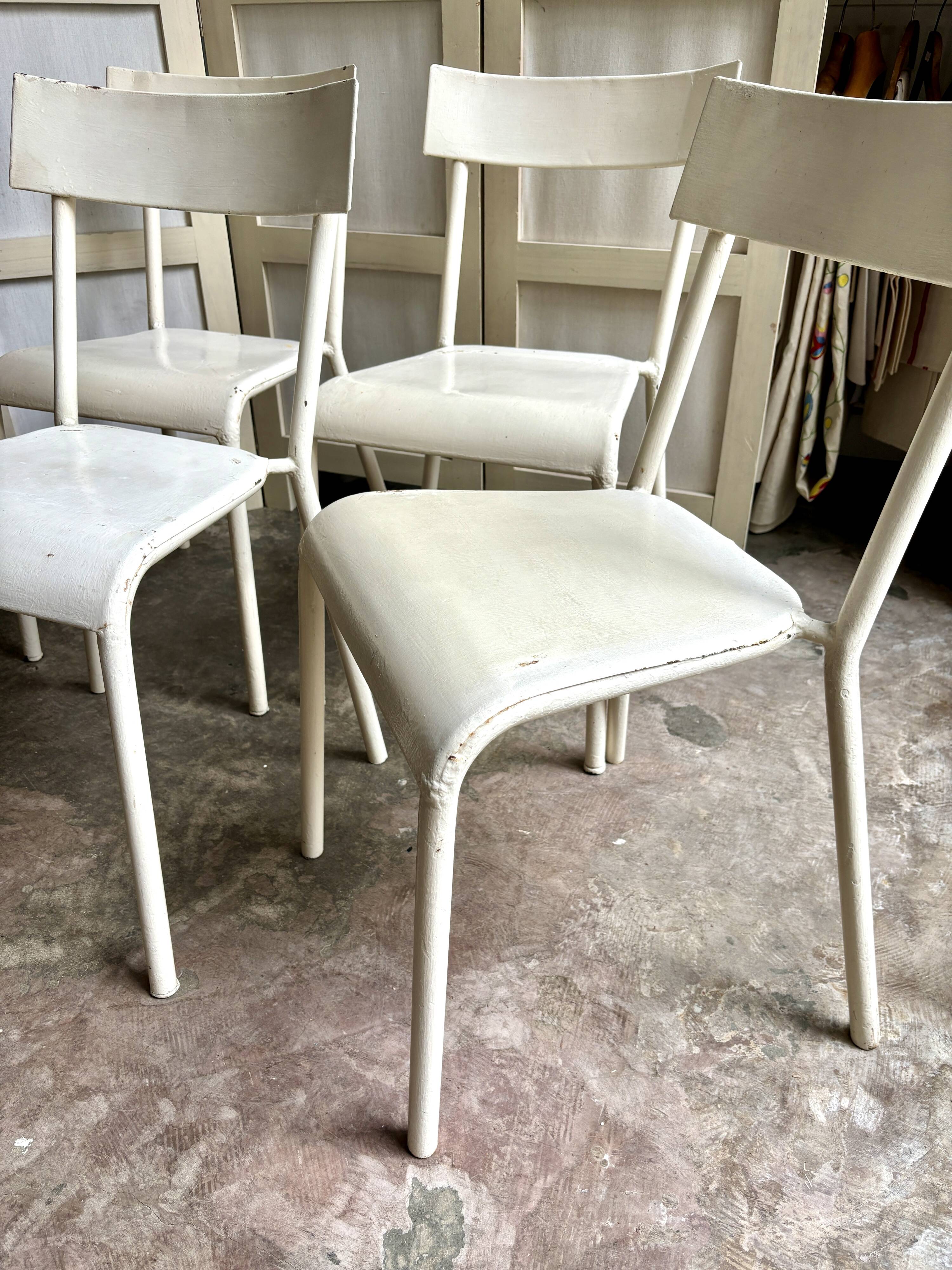 4 beige metal garden chairs