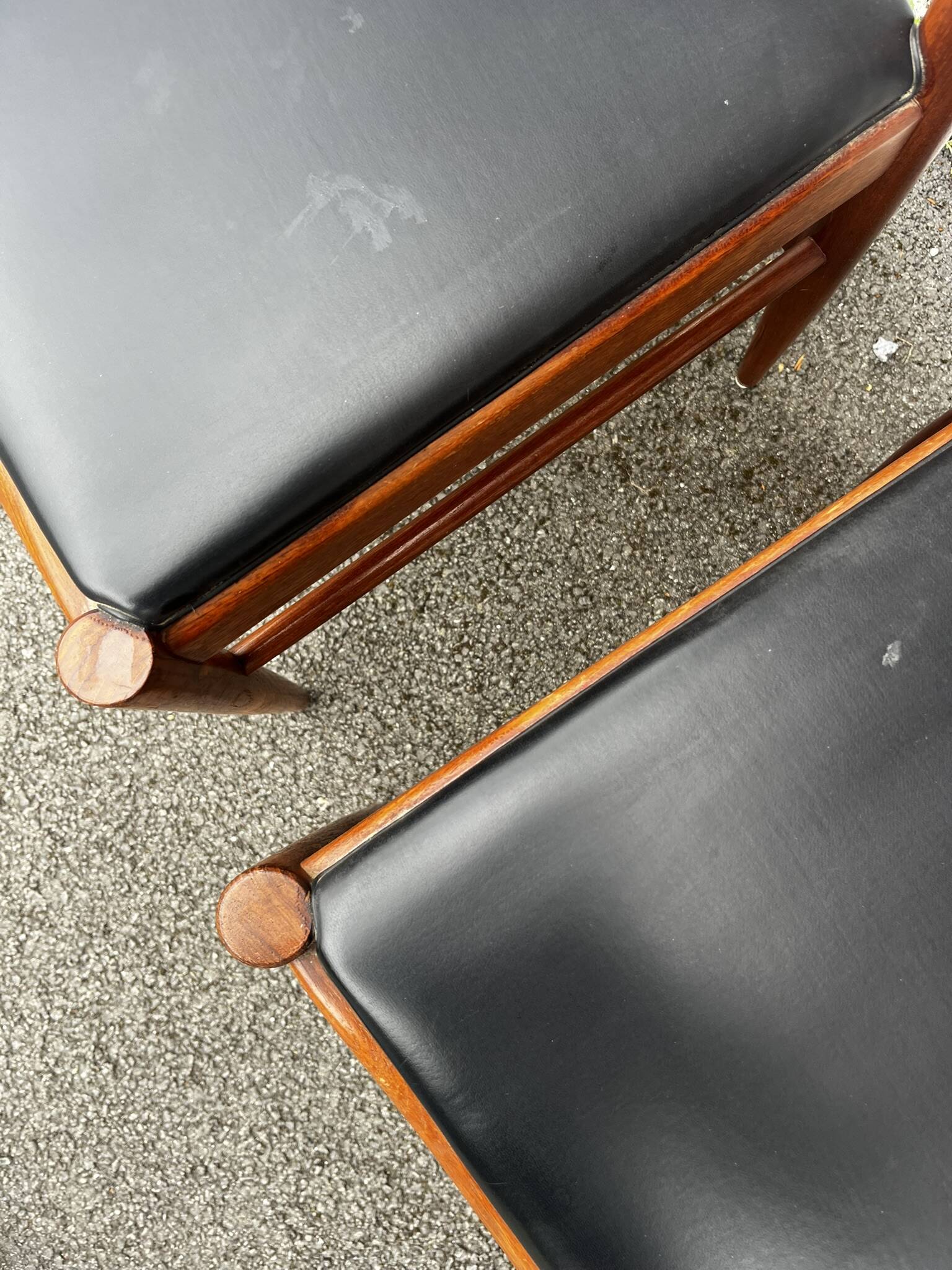 Set of 2 vintage Scandinavian chairs in wood and black faux leather.
